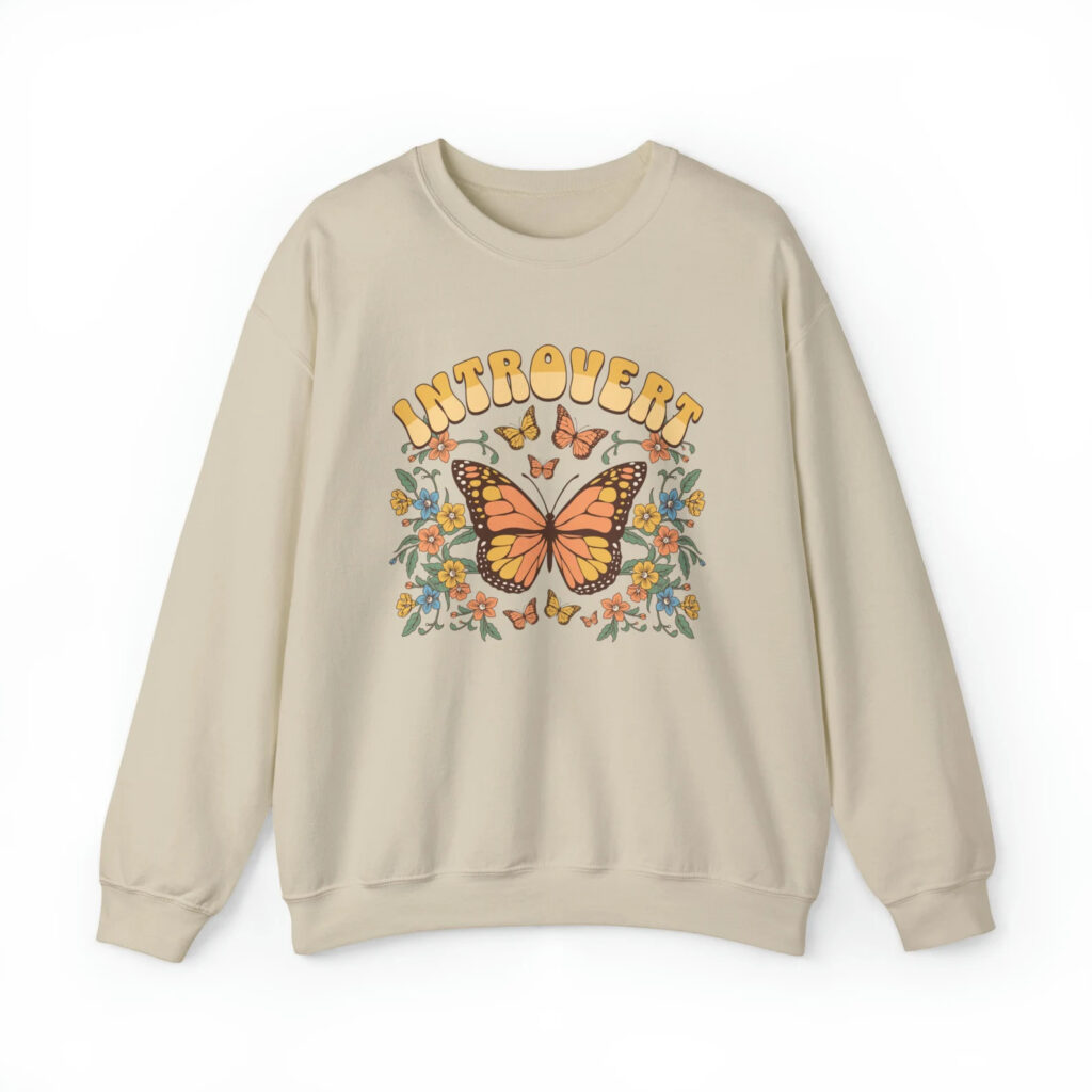 Sweatshirt decorated with the word introvert, butterflies, and flowers.
